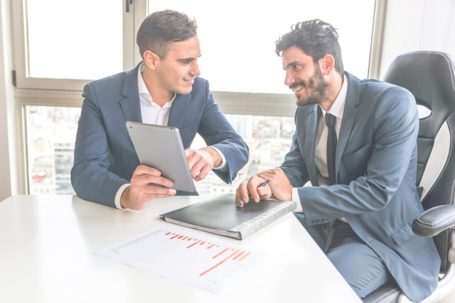Modern classroom setup with multiple monitors showing cloud infrastructure dashboards